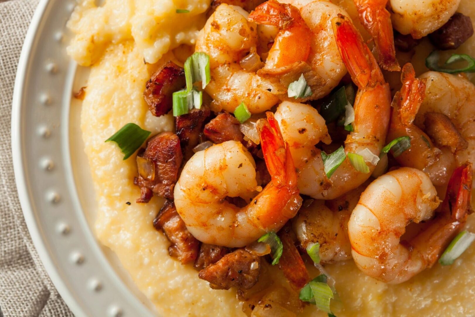 A close up of shrimp and grits on a plate