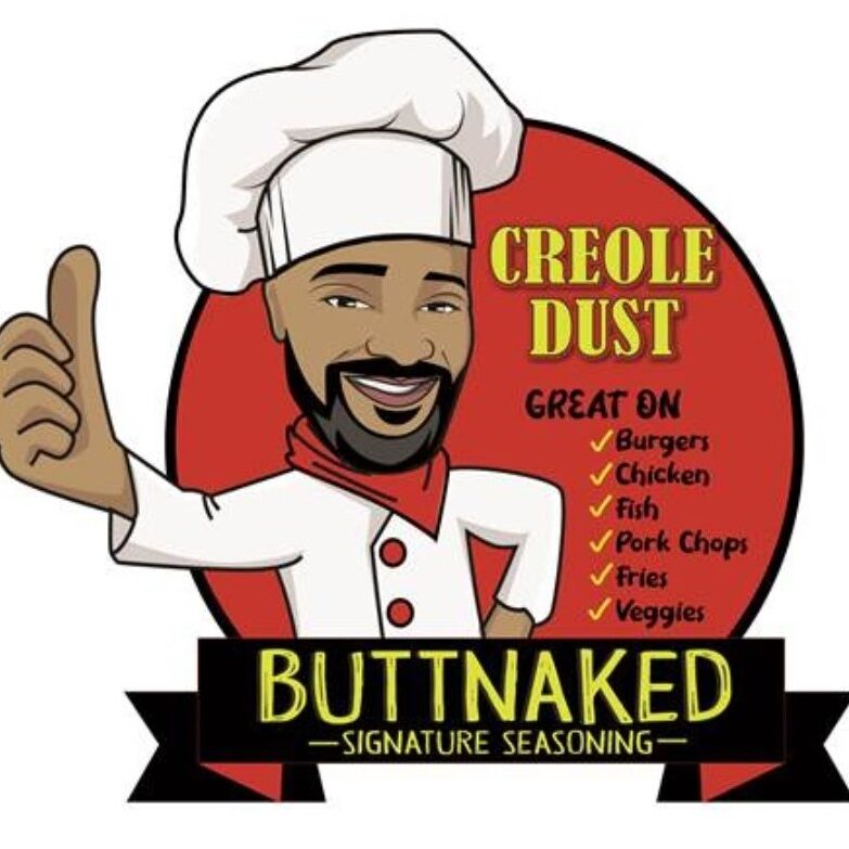 A chef with a beard and mustache giving the thumbs up.